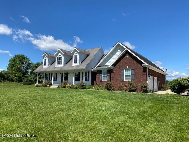 view of front of home with a garage and a front yard