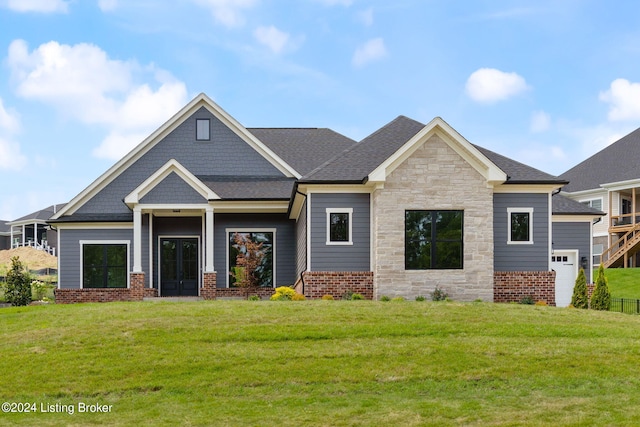 craftsman inspired home featuring a garage and a front yard