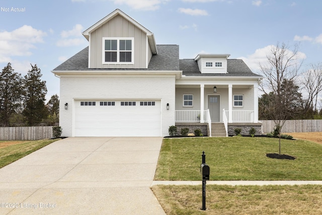 view of front of home with a porch and a front yard