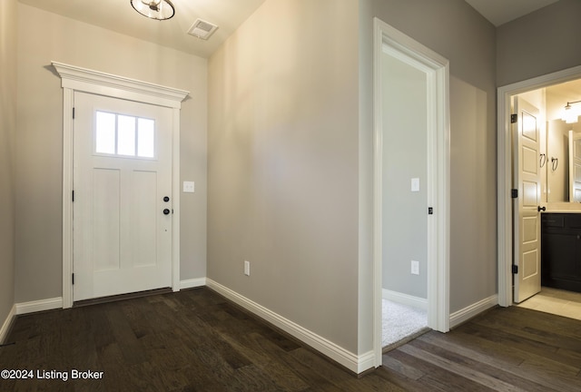 foyer entrance with dark hardwood / wood-style floors