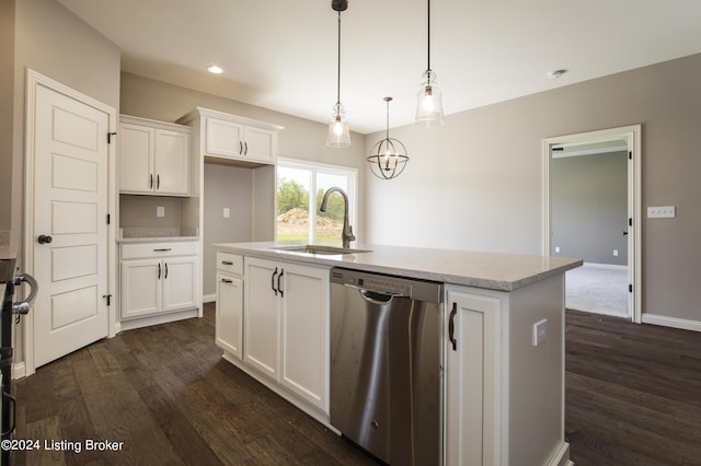 kitchen featuring sink, white cabinets, hanging light fixtures, stainless steel dishwasher, and a center island with sink