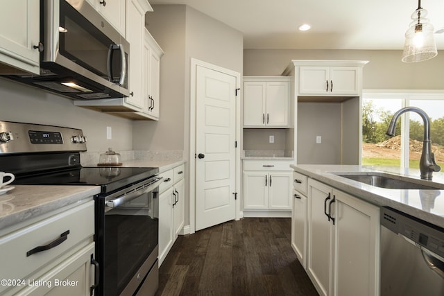 kitchen with sink, white cabinets, and appliances with stainless steel finishes