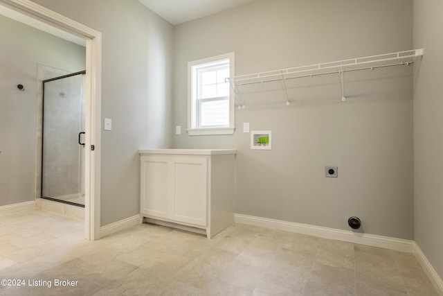 laundry room featuring cabinets, washer hookup, and electric dryer hookup