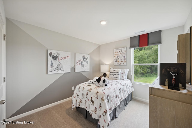 bedroom with carpet flooring and vaulted ceiling