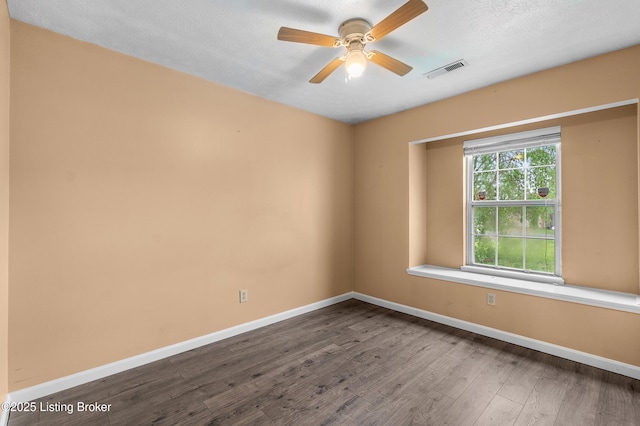136 Beechtree Ln, Mt Washington, KY 40047 - empty room featuring visible vents, baseboards, dark wood-style flooring, and ceiling fan