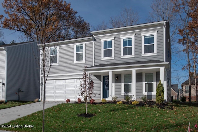 view of front of house with a garage and a front lawn