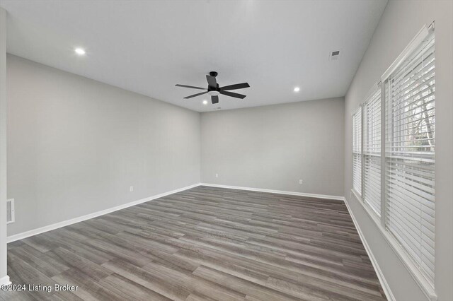 spare room featuring ceiling fan and hardwood / wood-style floors