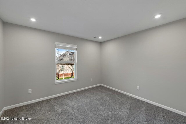 spare room featuring carpet floors