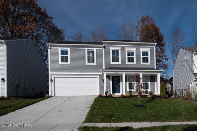 view of front facade featuring a garage and a front yard