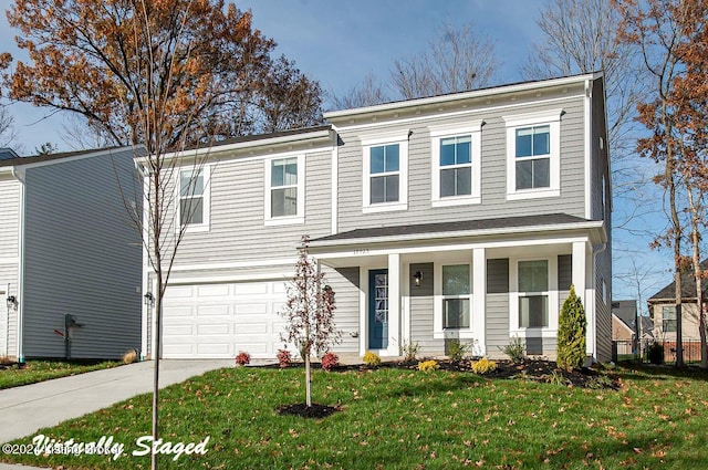 view of front of home with a garage and a front yard