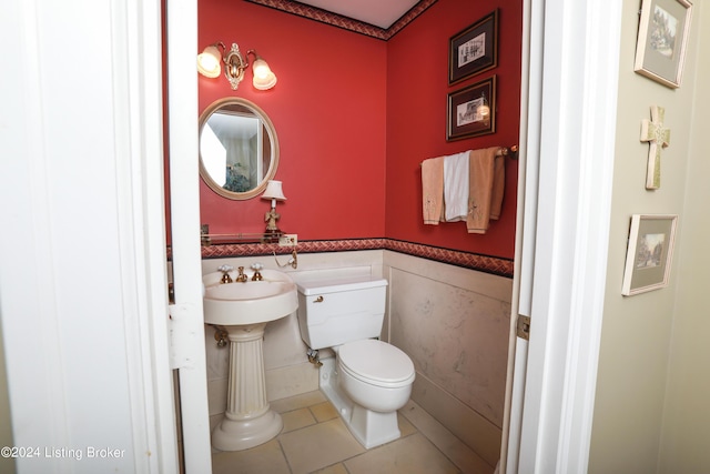 bathroom featuring tile patterned flooring and toilet