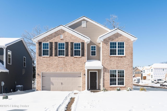 view of front of home with a garage and central air condition unit