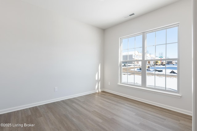 spare room featuring light hardwood / wood-style floors