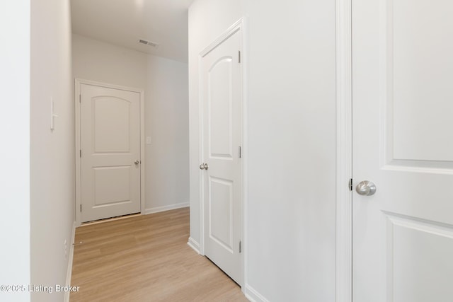 hallway featuring light hardwood / wood-style flooring