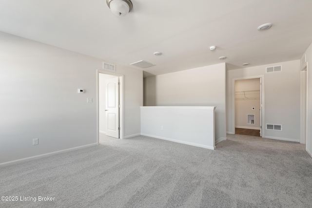 empty room featuring light colored carpet