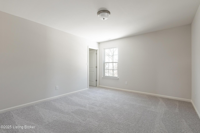 empty room featuring light carpet