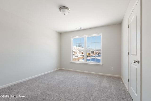 empty room featuring carpet floors