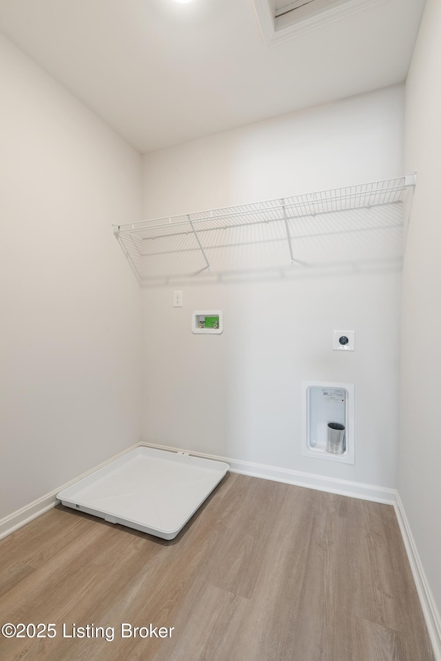 laundry room featuring electric dryer hookup, washer hookup, and hardwood / wood-style flooring