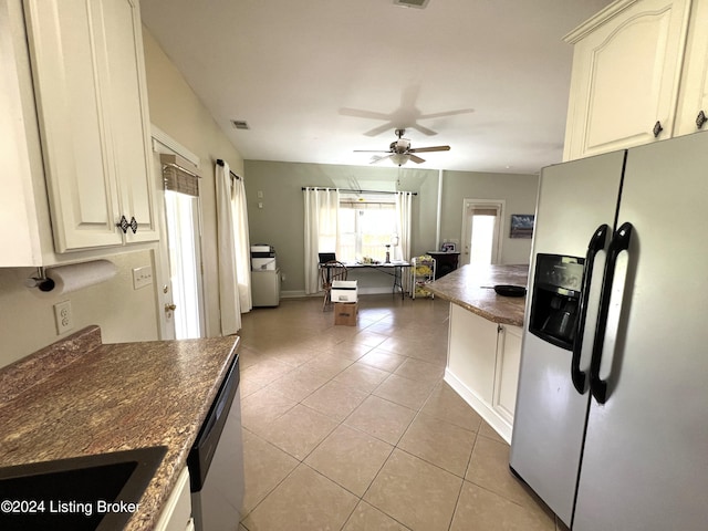 kitchen featuring white cabinetry, light tile patterned floors, stainless steel appliances, and ceiling fan