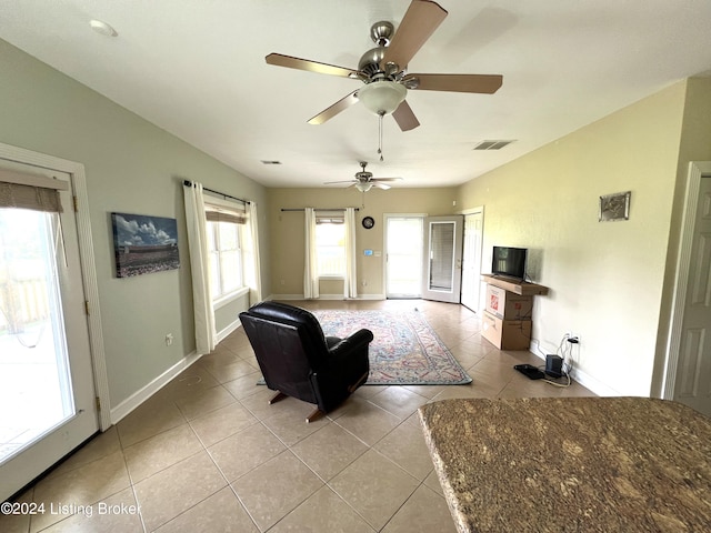 living room with light tile patterned flooring