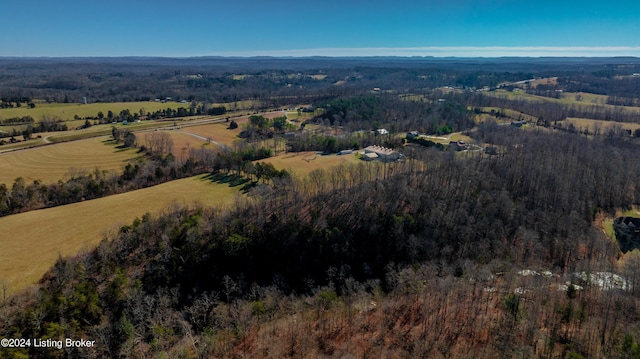 birds eye view of property with a rural view