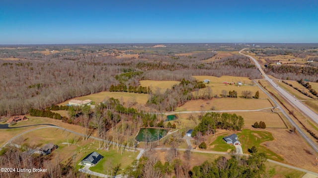 birds eye view of property with a rural view