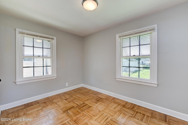 unfurnished room featuring light parquet floors