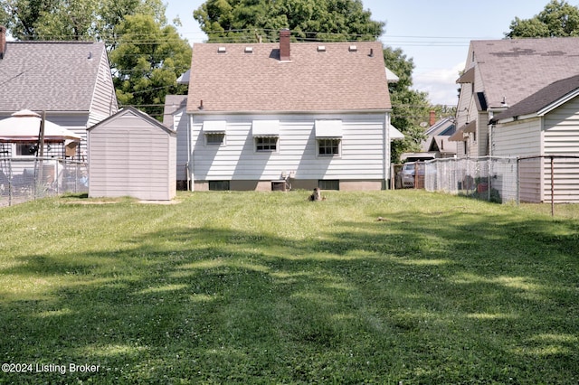 back of house with a yard