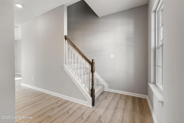 staircase featuring hardwood / wood-style floors