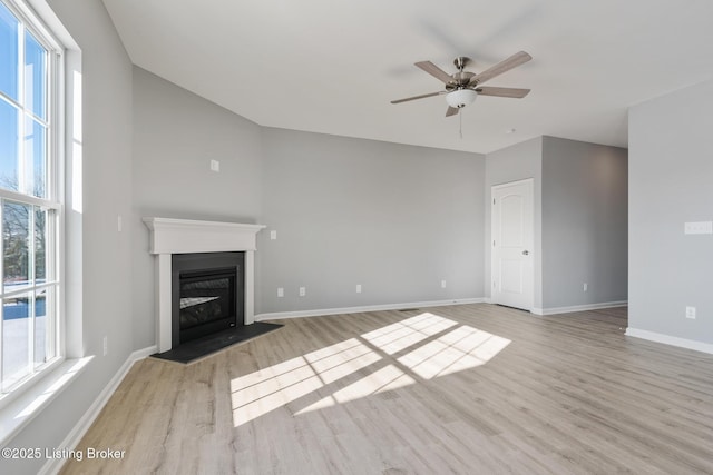 unfurnished living room with light hardwood / wood-style floors and ceiling fan