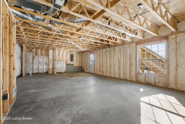 basement with plenty of natural light and electric panel