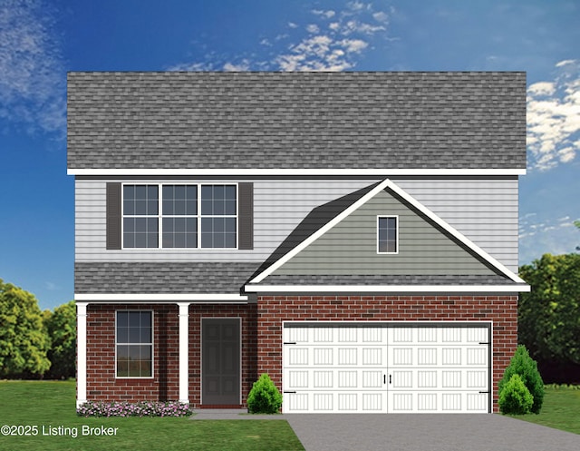 view of front of home featuring a front yard and a garage