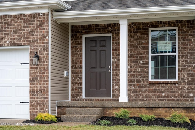 entrance to property featuring a garage