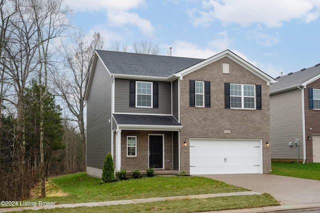 view of front of house featuring a garage and a front yard