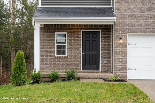 doorway to property featuring a garage