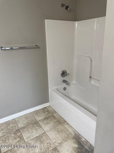 bathroom with tile patterned flooring and shower / bathing tub combination