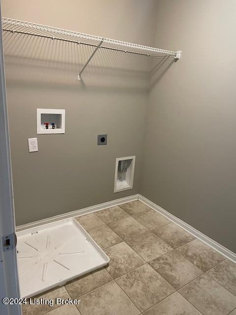 washroom featuring electric dryer hookup, tile patterned flooring, and hookup for a washing machine