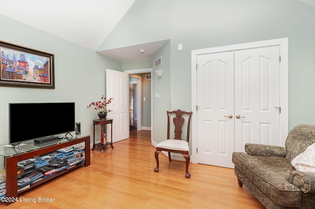 sitting room featuring vaulted ceiling and light hardwood / wood-style floors