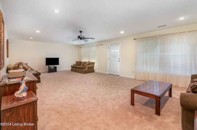 living room featuring ceiling fan and light carpet