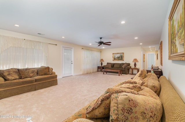 living room with carpet and ceiling fan