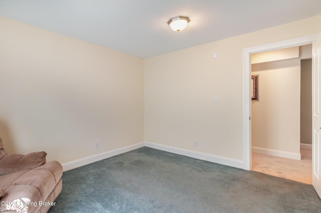 interior space with dark colored carpet