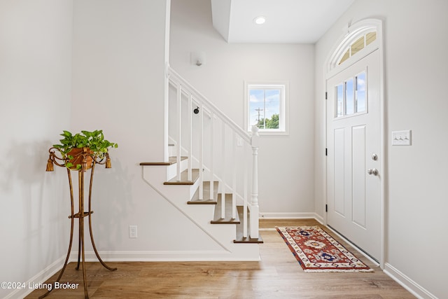 foyer entrance with hardwood / wood-style floors