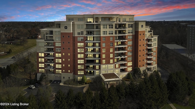 view of outdoor building at dusk