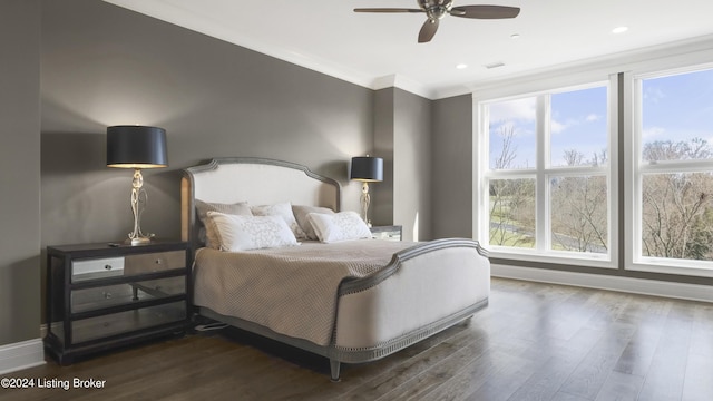 bedroom with ceiling fan, crown molding, and dark hardwood / wood-style floors