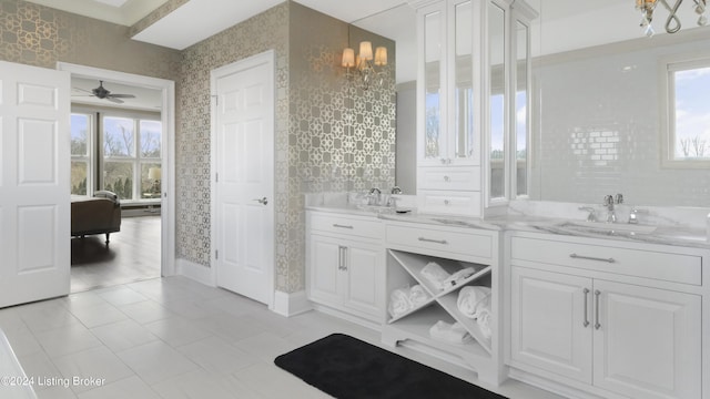 bathroom with ceiling fan and vanity