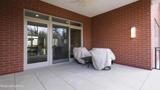 view of patio featuring ceiling fan