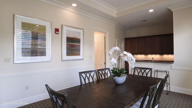 dining area featuring ornamental molding