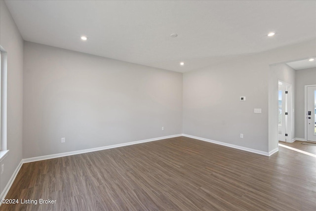 unfurnished room featuring dark hardwood / wood-style floors