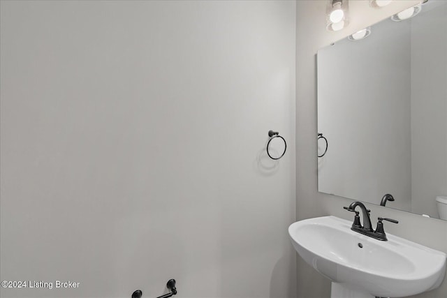 bathroom with toilet and sink