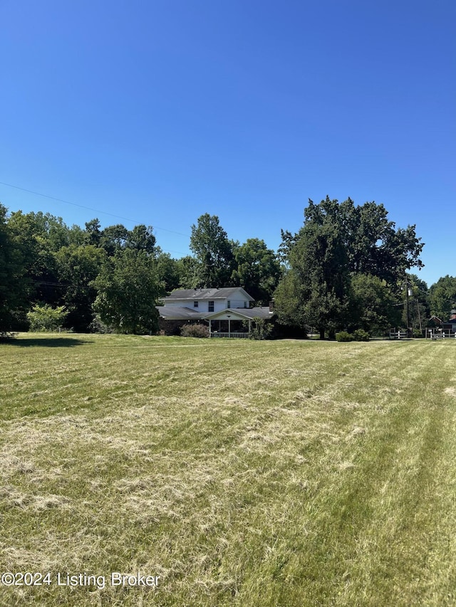 view of yard with a rural view